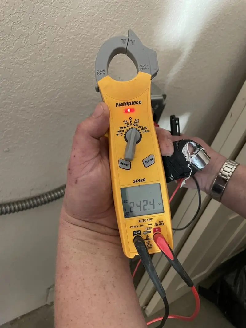Voltage testing with clamp meter during Outlet Installation in Cumberland